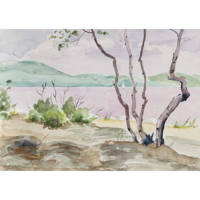 Eve Nethercott's serene depiction of a lake in Woodstock, New York, includes few elements other than a tree, shrubs, and...