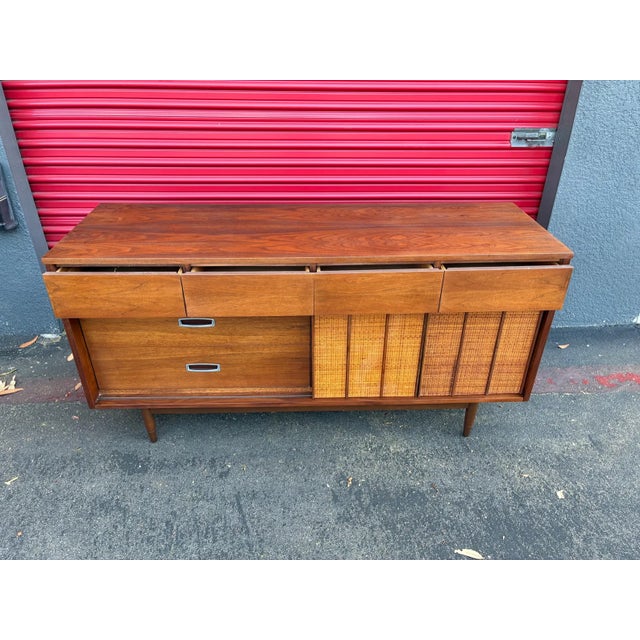 This is one of my favorite American made dressers. This vintage mid-century piece by Mainline by Hooker features a...