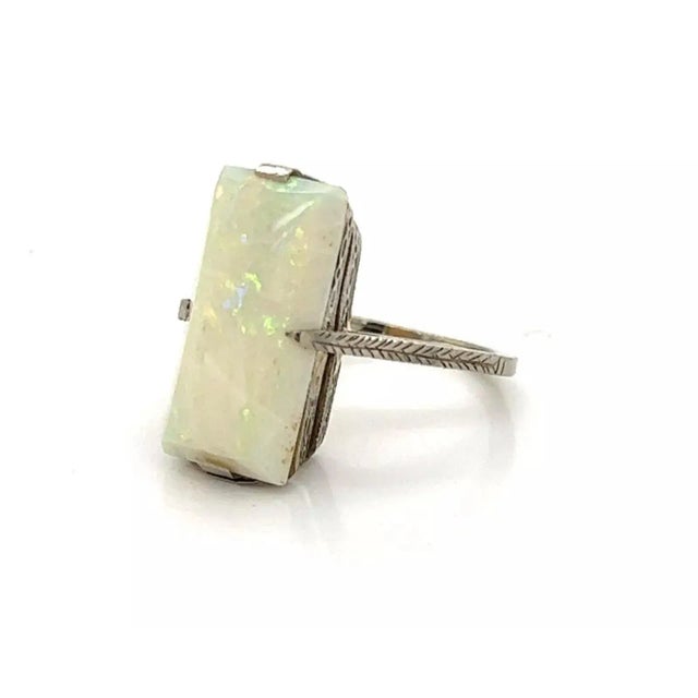 This is a beautiful Victorian ring, well crafted from 18k white gold with a lovely engraved leaf design around the double...