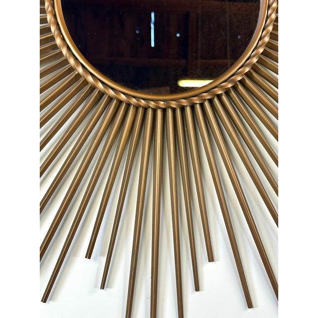 Vintage sunburst mirror by Chaty Vallauris, an iconic example of French design from the 1950s-1960s. This mirror features...
