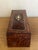 19th century French Thuya wood inlaid box covered with a burl veneer and decorated with a brass and mother of pearl emblem.