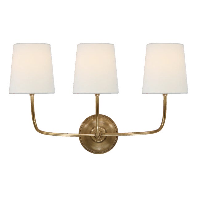Vendome Triple Sconce in Hand-Rubbed Antique Brass with Linen Shades Designer: Thomas O'Brien Finish: Hand-Rubbed Antique...