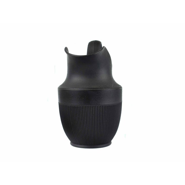 A striking example of French neoclassicism, this antique pitcher was produced by the celebrated Creil-Montereau...