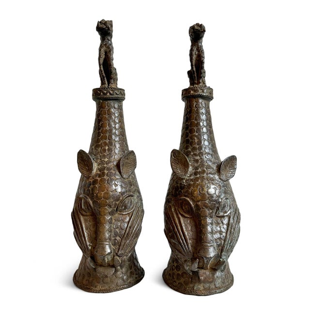 Striking sculptural antique Benin bronze leopard head finial cast in the traditional lost-wax technique associated with...