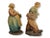 Pair of early 20th century Italian ceramic sculptures by Guido Cacciapuoti, depicting peasant figures carrying baskets...