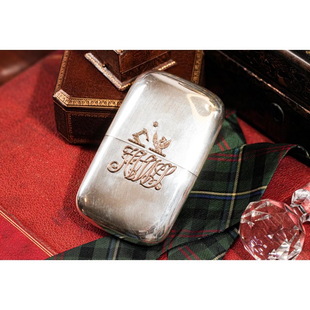 his exquisite Victorian-era cigar case, crafted by renowned London silversmiths Wright & Davies in 1887, embodies the...