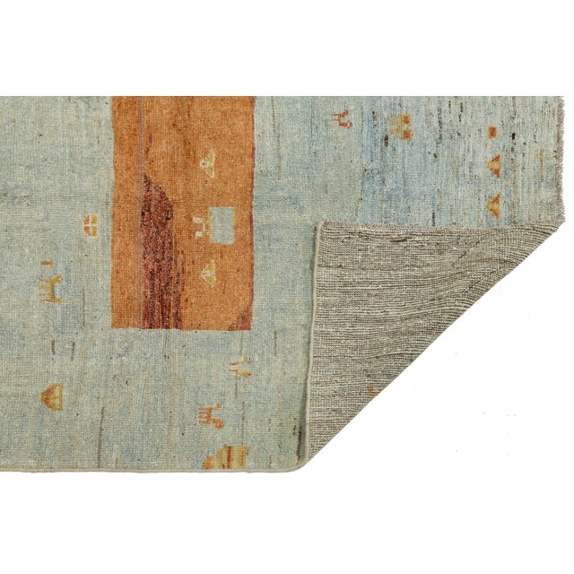 Elevate your home with this modern Gabbeh wool rug. Hand-knotted using traditional techniques, it combines Persian tribal...