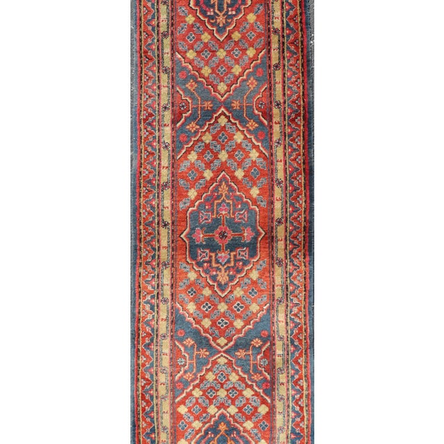 Measures: 2'5 x 11'9 Antique Khotan Runner in Deep Indigo, Rust Red, and Soft Yellow Tones. Keivan Woven Arts /...