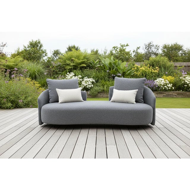 "Serene Outdoor LoveSeat brings a smooth, sculptural look to any living space. Wrapped in soft grey bouclé fabric, it...