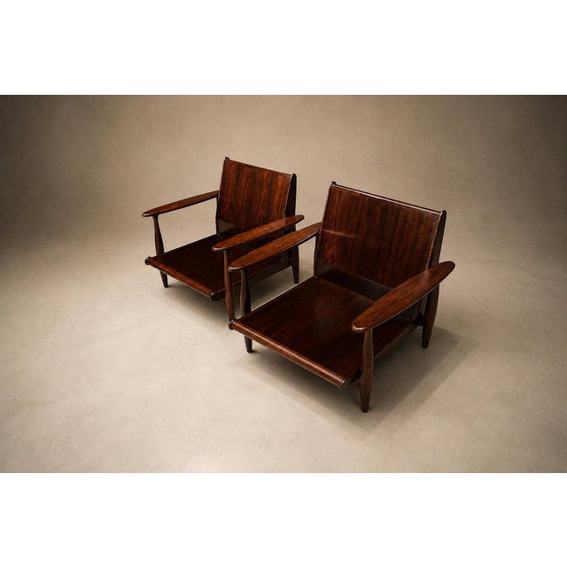 A powerful and refined pair of Brazilian modern armchairs produced by Liceu de Artes, dating to the 1960s. Executed in...