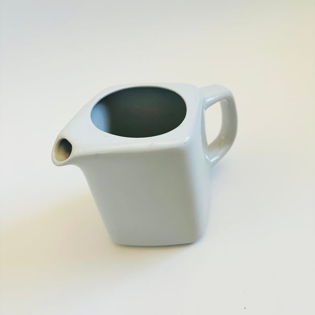 A mid century modern ceramic pitcher by Arabia, Finland. Great minimalist angled design with a slanted top designed to act...
