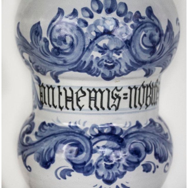 Vintage blue & white ceramic & wooden lamp with an inscription in latin. I can't decipher the first word, but the second...