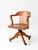 Antique W.H. Gunlocke oak banker’s chair dating to the early 20th century, exemplifying the exceptional craftsmanship and...