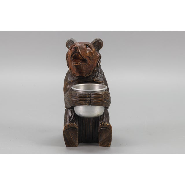 This beautiful hand-carved wooden seated bear is holding an aluminum pot. Nicely detailed, with glass eyes. Can be used...