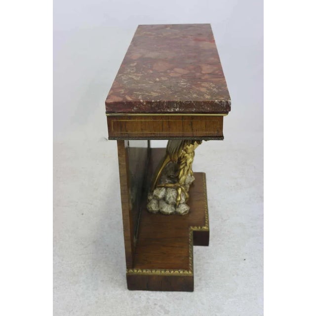 Antique Exquisite Federal Style pier table in the manner of William Kent, circa 1860. Crafted from rosewood and mahogany...