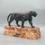 An early 20th century bronze sculpture cast after the original ' Tigre qui Marche' by Antoine Louis Barye. Set over a...