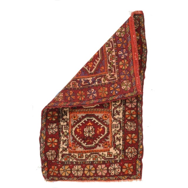 Probably Central Anatolian, the tripartite paneled field in mauve and red, contains three nested and fringed hexagons in...