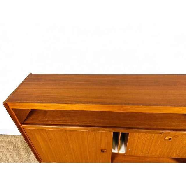 A stunning scandinavian/vintage sideboard with a clean design, characteristic of 1960s scandinavian furniture. Its...