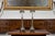 A pair of English vintage silverplate two-light table lamps from the mid-20th century, with bobbin accents and pierced...