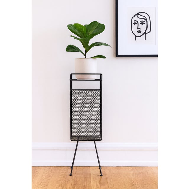 A striking 1950s Mid-Century Modern wire mesh telephone table / plant stand in the style of Richard Galef. This sculptural...