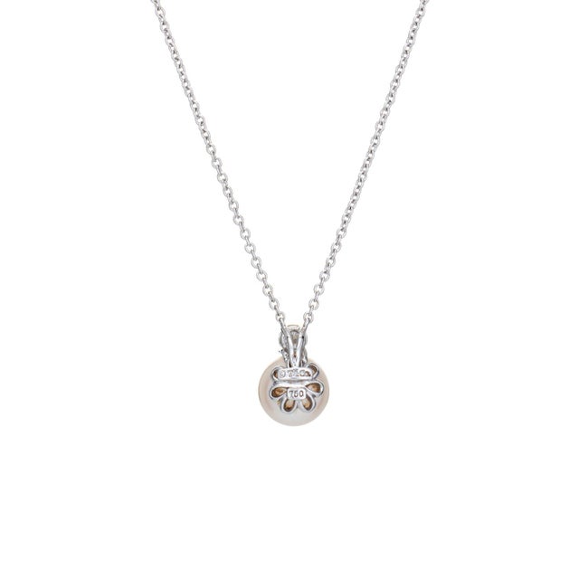 Stylish and finely detailed pre-owned Tiffany & Co signature pearl & diamond necklace crafted in 18k white gold (circa...