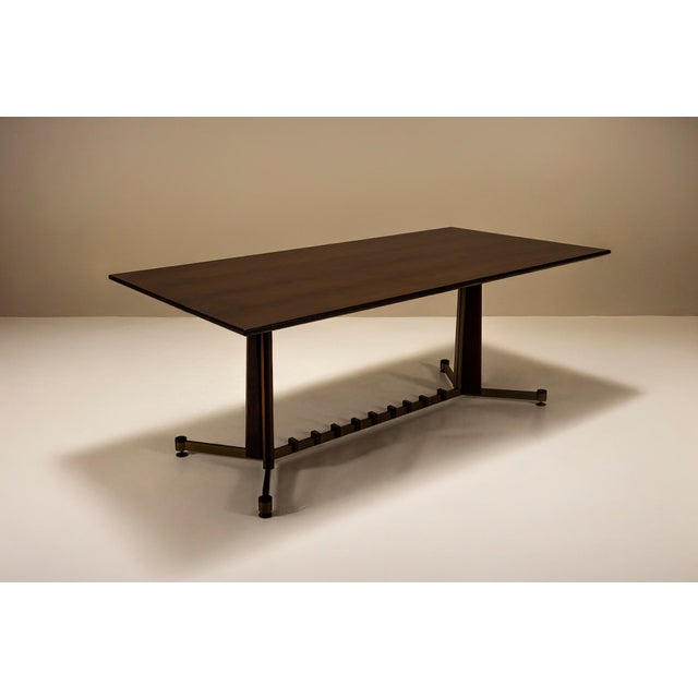 Italian design from the 1960s often balanced boldness with subtle detailing. This vintage dining table is no exception....