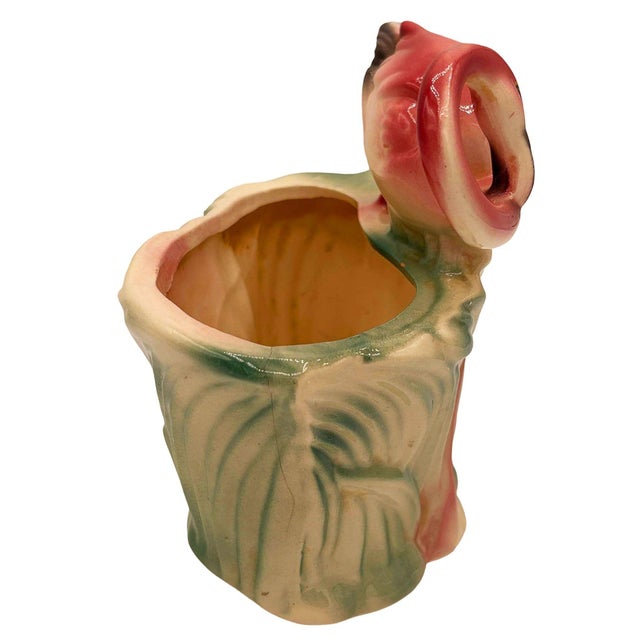 Mid-century pink and green ceramic flamingo tabletop California pottery tabletop planter. The planter features a...