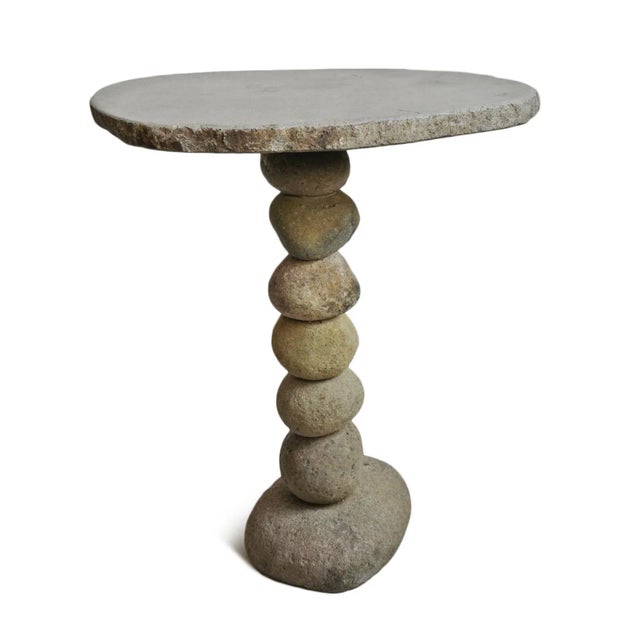 Hand crafted vintage stacked river rock outdoor bistro table. Beautiful organic modern style piece with natural tones and...