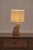 Distinctive French table lamp from the 1970s, crafted from solid natural sandstone. The sculptural base features an...