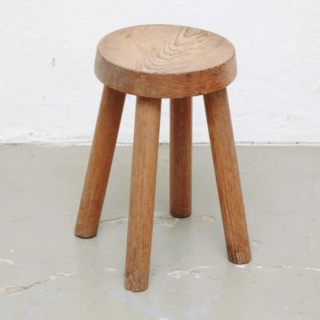 Stool designed by Charlotte Perriand, circa 1960 for Les Arcs. Manufactured in France. In original condition, with wear...