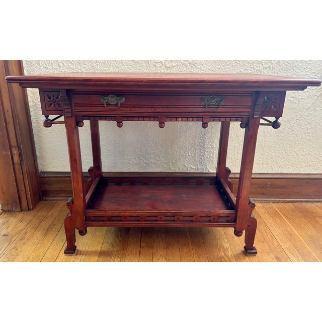 Early 20th century Victorian ball and stick accent table, which can function beautifully as a dry bar, with a drawer for...