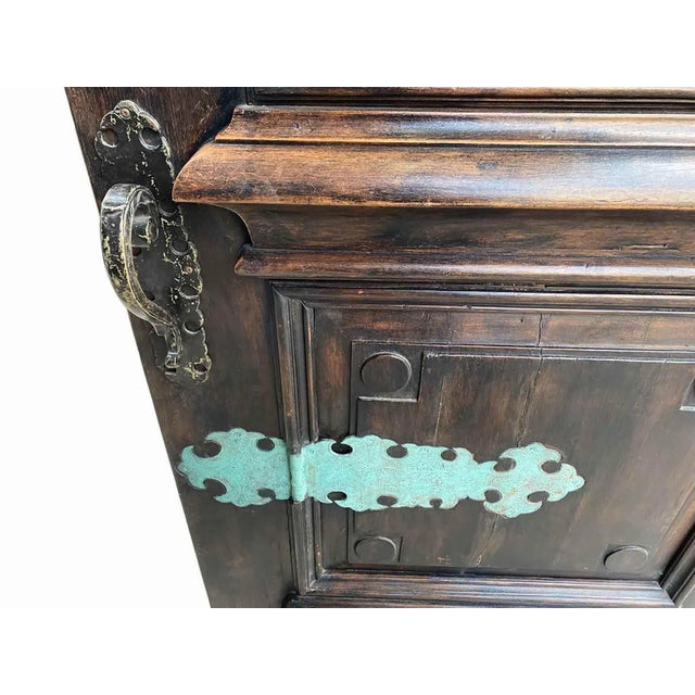 Vintage Baroque style walnut entry door with inlaid ornamental bronze strap hinges. This impressive door has two square...