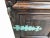 Vintage Baroque style walnut entry door with inlaid ornamental bronze strap hinges. This impressive door has two square...