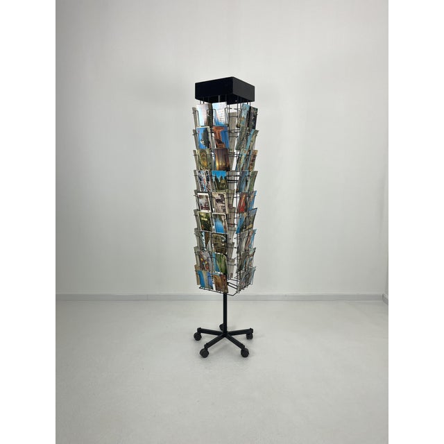 Vintage revolving display with postcards, made in Italy from the 1960s On wheels. Complete with many postcards, some new...