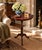 A handsome Georgian-style drinks table crafted in rich mahogany and finished with a beautifully embossed burgundy leather...