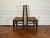 A set of ten English elm wood ladder back dining chairs (two arm chairs and six side chairs) in a rich dark brown finish...