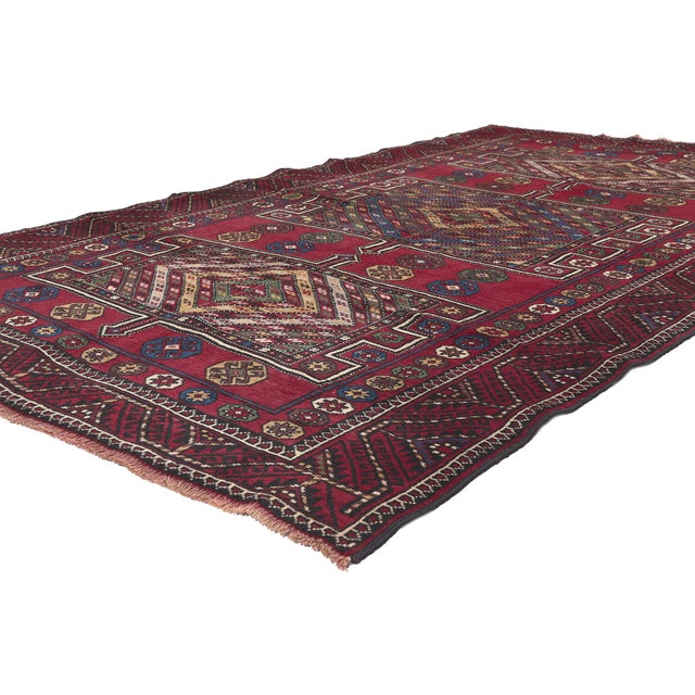 61233 Antique Nomadic Afghan Baluch Rug, 05'03 x 09'04. This enchanting hand-knotted wool antique Afghan Baluch rug is a...