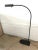 Black postmodern floor lamp designed by Ron Rezek, perfect as a reading lamp.