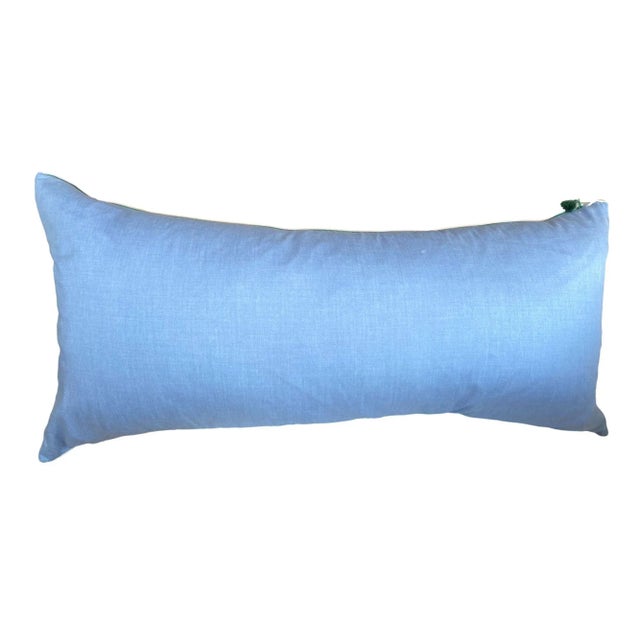 This pillow features a soft blue linen back and a vibrant front with colorful stripes in shades of pink, purple, and blue,...
