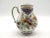 Charming vintage Dutch Delft jug hand molded and hand painted in polychrome with a geometric, floral and foliate design....
