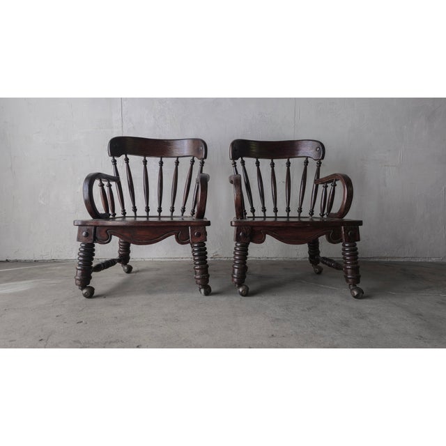 This pair of antique English Windsor lounge chairs are incredible. Can't find another pair quite like them. They are great...