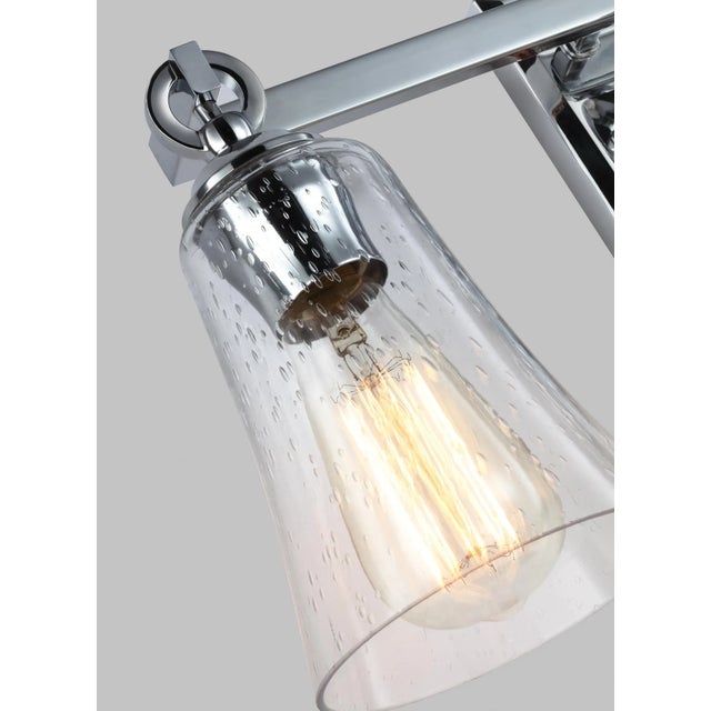 The Sean Lavin Monterro three light vanity fixture in chrome offers shadow-free lighting in your powder room, spa, or...