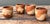 Celebrate the earthy, tactile allure of this set of four original studio pottery cups, a quintessential example of the...