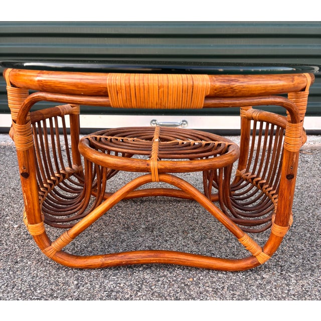 Wonderful Italian style midcentury rattan and glass top coffee table or accent table. It’s a versatile size and can be...