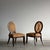 A pair of Barbara Barry Oval X-Back side chairs for Baker Furniture, with the designer's signature crossed-bar motif set...