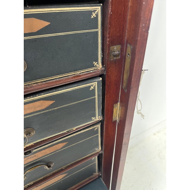 Louis Philippe period mahogany and mahogany veneer filing cabinet Two rows of twelve boxes with brass handles Individual...