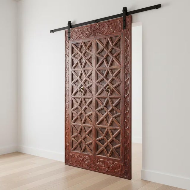 Step into a world of timeless artistry and storied heritage with this breathtaking Custom Hand Carved Teak Wood Barn Door....