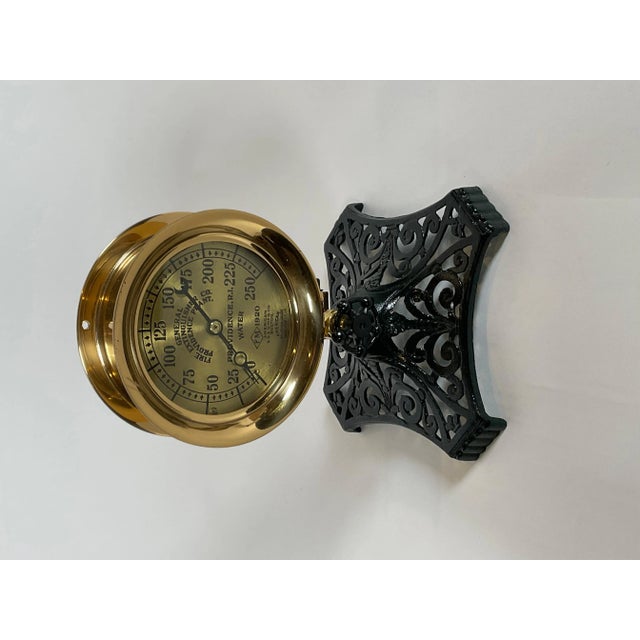 Polished and lacquered water pressure gauge by General Fire Extinguisher Company, Providence Plant. Mounted to an iron...