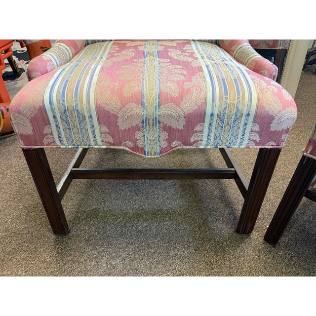 Pair of traditional Chippendale host and hostess chairs.Serpentine top detail, damask pattern fabric.
