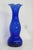 This brilliant cobalt blue Vase is made of glass. This compact vase presents a lovely vintage style with a ruffled opening...